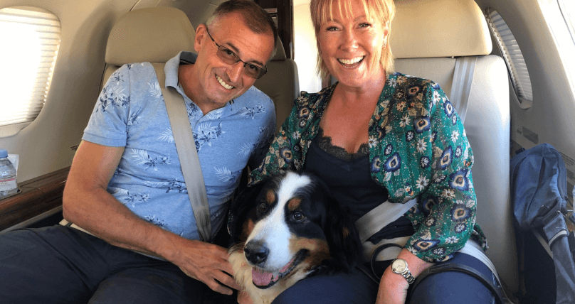 Passengers on private jet with their dog