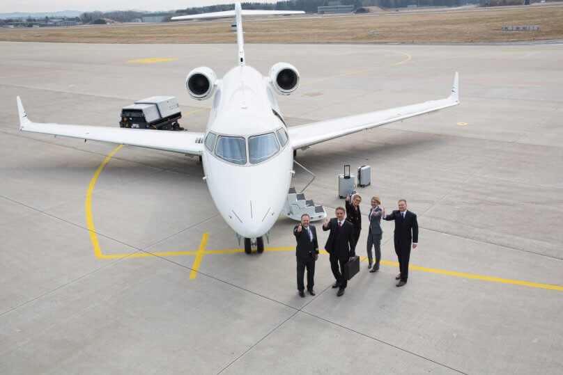 Private jet team Glasgow on the airport apron with a jet