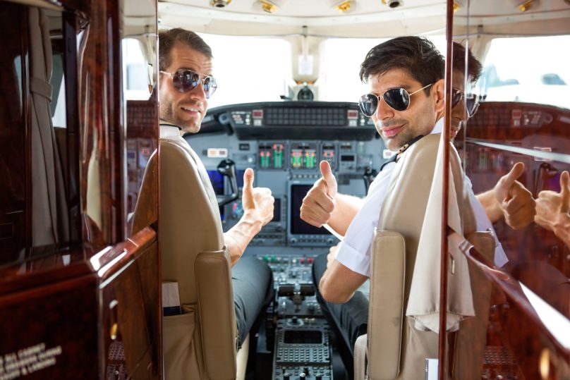 Pilots in the cockpit of a private jet