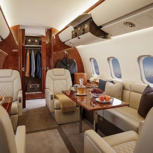 Luxurious private jet interior with spacious luggage storage and stylish bags