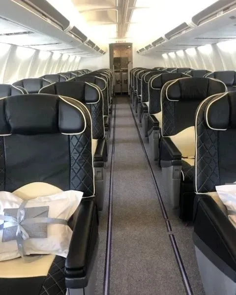 103e6036-a3ed-4d05-86aa-d76b384a680fwebp ► Charter-A Ltd Charter-a ltd interior view of a luxurious private jet cabin with plush seating