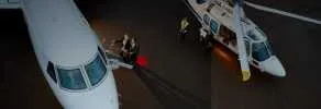 Helicopter landing in a scenic location illustrating the advantages of helicopter charters